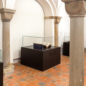 Exhibition rooms in the crypt of the church with a view of the Shedel Chronical of the World