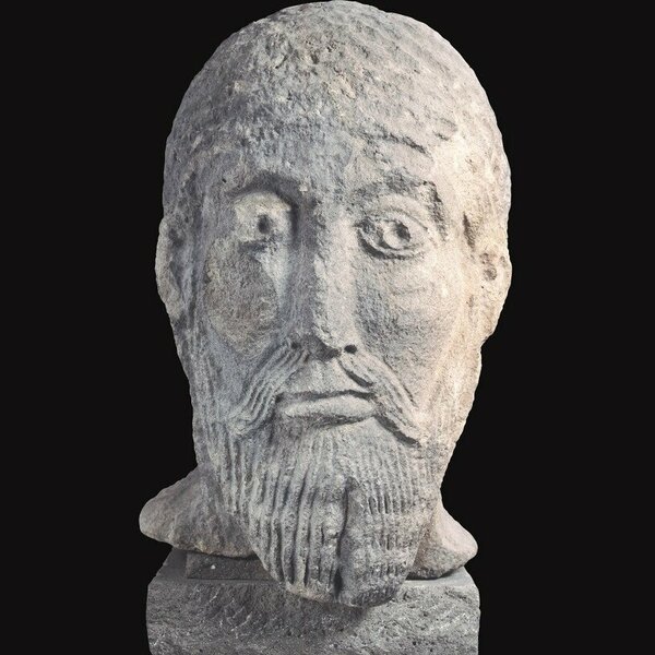 Stone carving: Head of a bearded man