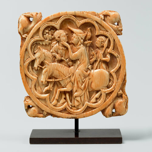 Ivory carving depicting a couple riding together
